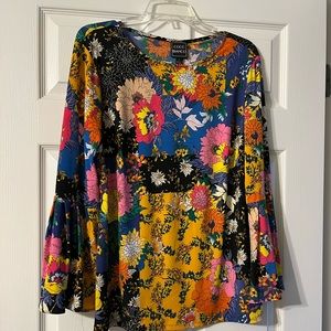 Adorable mixed print top. So fun! Dress up or down